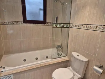 a bathroom with a toilet and a shower and a tub at PINEDO PLAYa in Valencia
