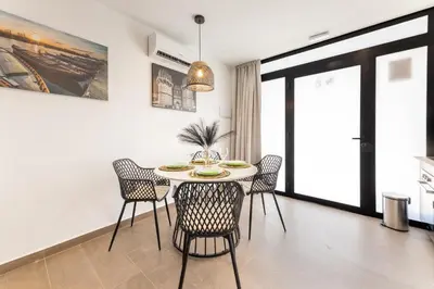 a dining room with a table and chairs at Loft Urban Beach - Cerca del Mar in Valencia