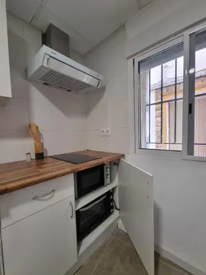 a kitchen with a counter top and a microwave at Rural studio in Cortez de Pallas