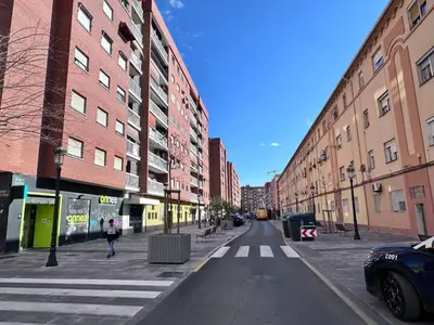 an empty street in a city with buildings at Habitacion privada con baño privado III in Valencia