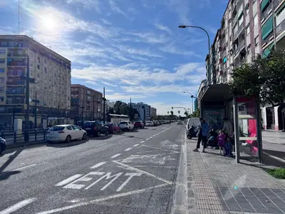 a city street with cars parked on the side of the road at Habitacion privada con baño privado III in Valencia