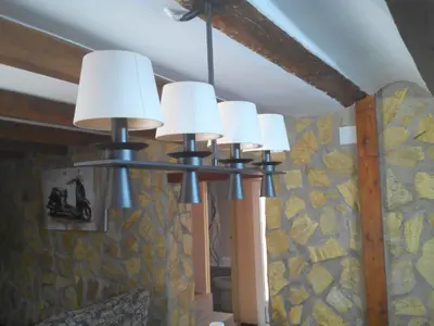a group of lights hanging from a ceiling at Ca'l Suecà in Chella