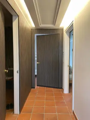 a hallway with a door and a tile floor at Casa with View in Alginet