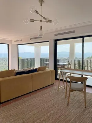 a living room with a couch and a table at Casa with View in Alginet