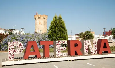 a sign in front of a building with a tower at Bonita casa cueva con jacuzzi in Paterna