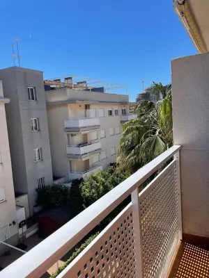 a balcony with a view of some buildings at Encantador Apartamento dúplex con vistas al mar in Canet de Berenguer