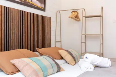 a bedroom with a bed with pillows on it at SingularStays Olimpia in Valencia