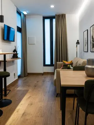 a living room with a couch and a table at Dos Corazones in Valencia