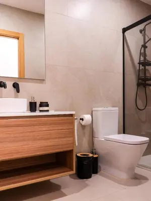 a bathroom with a toilet and a sink at Dos Corazones in Valencia