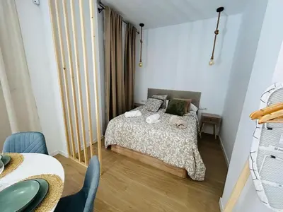 a small bedroom with a bed in a room at Loft Sofia a estrenar con luz natural en corazon de Valencia in Valencia