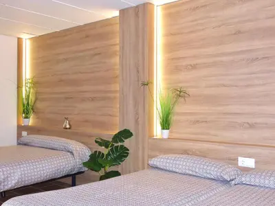 a hospital room with two beds and two plants at Casa Playamonte in Navarrés
