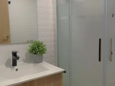 a bathroom with a sink and a shower at Casa Playamonte in Navarrés