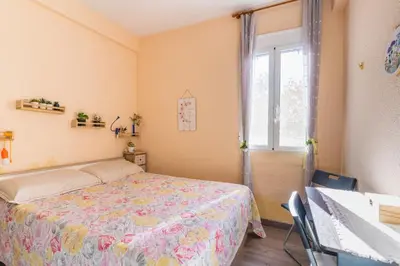 a bedroom with a bed and a window at Invalencia - Begis Flat Cabanyal in Valencia