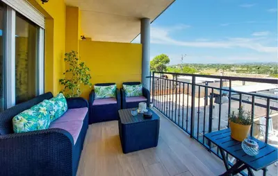 a balcony with couches and a table with a view at Awesome Home In Turis in Turís