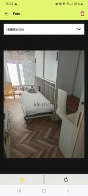 a picture of a bedroom with a bed and a chair at FC house in Valencia