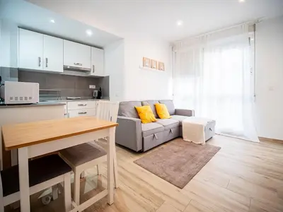 a living room with a couch and a table at Apartment Ruzafa Market 6C in Valencia