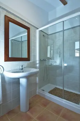 a bathroom with a sink and a shower at Casa Rural 
