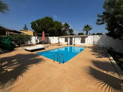 a swimming pool in the middle of a yard at Casa Mallaeta in Puebla de Vallbona