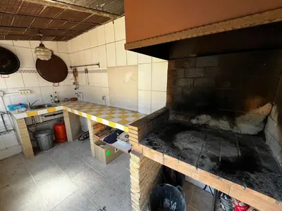 an overhead view of a kitchen with a brick oven at Casa Mallaeta in Puebla de Vallbona