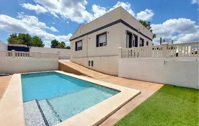 a house with a swimming pool in the backyard at Amazing Home In Turís in Turís