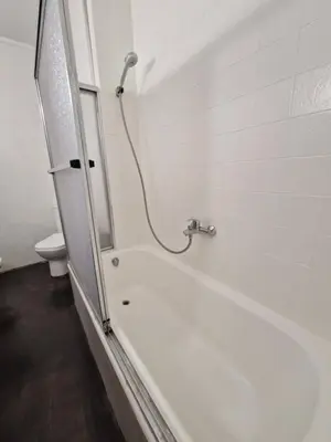 a bathroom with a bath tub and a toilet at 3 Bedroom Apartment with Balcony, Lift and AC in Every Room, 114 m2 in Nules