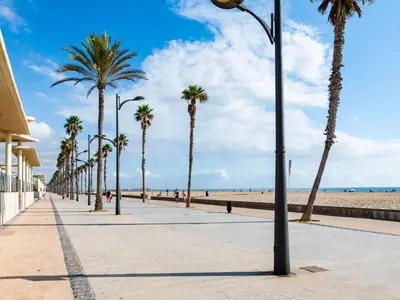 a street with palm trees on the beach at Apartment Playa Patacona by Interhome in Valencia