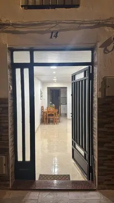an open door to a room with a dining room at Casa Alan in Burriana