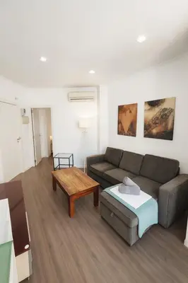 a living room with a couch and a coffee table at Apartment Market Ruzafa 10B in Valencia