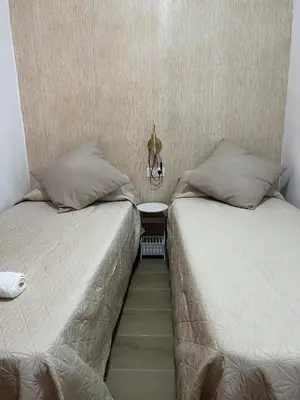 two beds sitting next to each other in a room at Estupendo apartamento en Llíria in Lliria