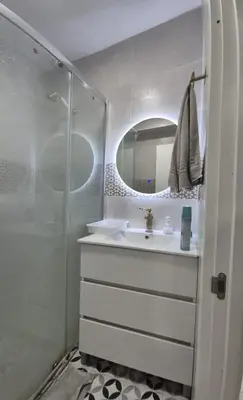 a white bathroom with a sink and a mirror at Valencia Centro 3 compartido in Valencia