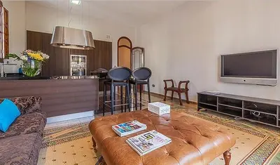 a living room with a couch and a tv at Beautiful House with terrace in Valencia