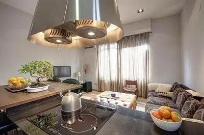 a living room with a couch and a table with a bowl of fruit at Beautiful House with terrace in Valencia
