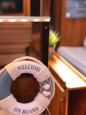 a ribbon that says welcome on board on a boat at Unique Experience in Sailboat! In The 4 Seasons!! B shi in Valencia