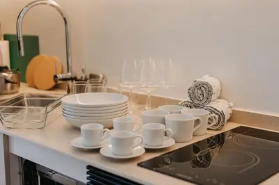a kitchen counter with cups and plates and a sink at Exclusivo loft 3 en zona privilegiada en Valencia in Valencia