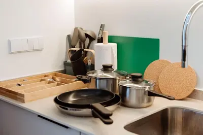 a kitchen counter with pots and pans and a sink at Luxury apartment in Valencia in Valencia