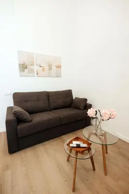 a living room with a couch and a glass table at Luxury apartment in Valencia in Valencia