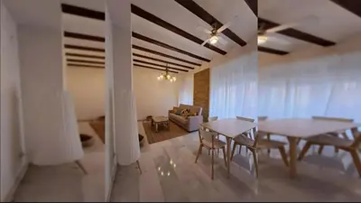 a living room with a table and chairs and a couch at Your apartment in the heart of Valencia in Valencia