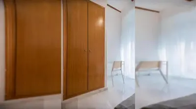 a wooden cabinet in a room with a table at Your apartment in the heart of Valencia in Valencia