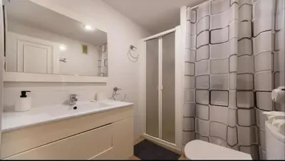 a bathroom with a sink and a toilet and a shower at Historic Center - Loft in the heart of Valencia in Valencia