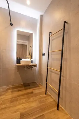 a bathroom with a sink and a mirror on the wall at Rice Museum Apartments in Valencia