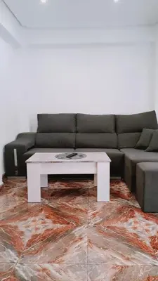 a living room with a couch and a coffee table at Piso perfecto in Mislata