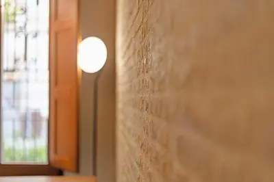 a close up of a wall next to a window at Guestready - Bright stay at Cabanyal in Valencia