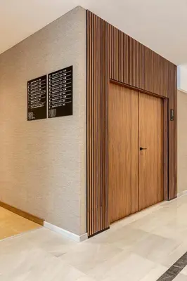a wooden door in a room with a wall at B48 Valencia Feria in Valencia