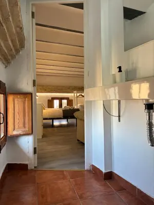 a hallway leading to a room with a living room at Trenor Apartments in Valencia