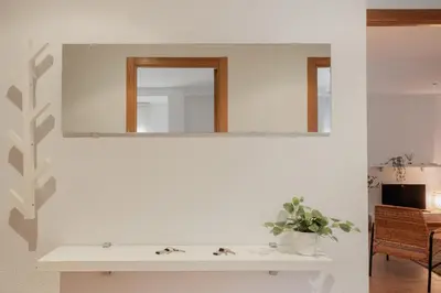 a bathroom with a mirror and a sink at Apartamentos FV Flats Valencia - Mestalla 5 in Valencia