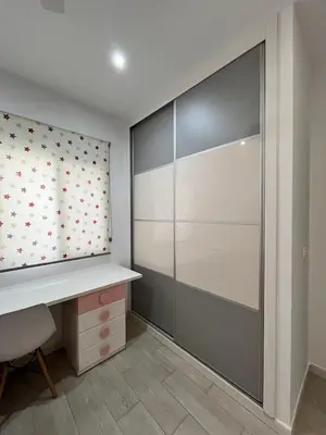 a room with a desk and a sliding glass door at Casa moderna en Manises con 2 terrazas in Manises
