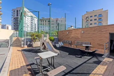 a playground with a slide on the roof of a building at GuestReady – Modern Flat with Terrace in Valencia in Valencia
