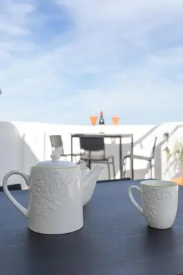 two coffee mugs sitting on a table with a balcony at Seaview Apartment N12 in El Perelló