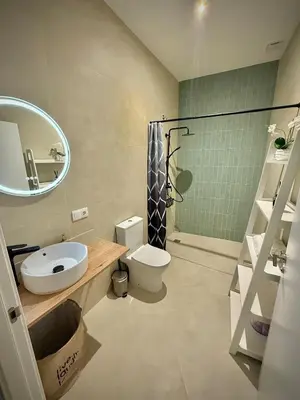 a bathroom with a sink and a toilet and a shower at Glamour Suite 2 next to the city center in Valencia
