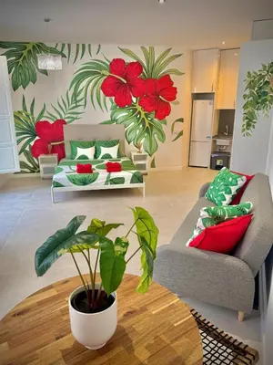a living room with a couch and a table at Glamour Suite 2 next to the city center in Valencia